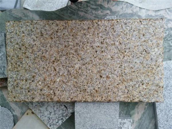 gold granite tile bush-hammered